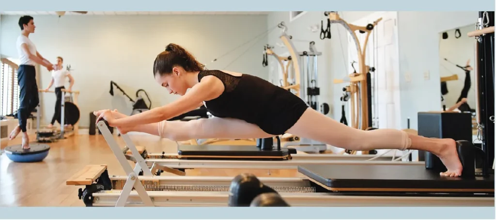 Students participating in Pilates and body conditioning class